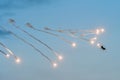 Jet military plane MIG 21 launching rockets flares at an Airshow