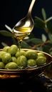 A jet of olive oil amidst an elegant olive branch and a spoon
