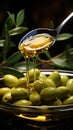 A jet of olive oil amidst an elegant olive branch and a spoon