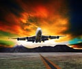 Jet plane flying over runways and beautiful dusky sky with copy