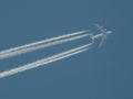 Jet plane with vapor trails