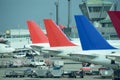 Line of parked colorful jet planes. Busy airport. Royalty Free Stock Photo