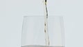 Jet pouring foamy beer vessel slow motion. Barley alcohol drink glassware macro