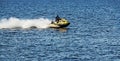 A jet ski with a man racing along the wide Dnieper River in Dnepropetrovsk