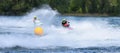 Jet Ski  race competitor cornering at speed creating at lot of spray. Royalty Free Stock Photo