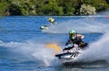 Jet Ski  race competitor cornering at speed creating at lot of spray. Royalty Free Stock Photo