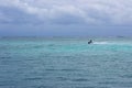 A jet ski races across the Caribbean inside the Meso-American reef.