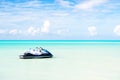 Jet ski on turquoise sea water in Antigua. Water transport, sport, activity. Speed, extreme, adrenaline. Summer vacation on caribb Royalty Free Stock Photo