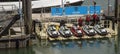 Jet skis for rental and lessons on the Barbican landing stage, Plymouth. Royalty Free Stock Photo