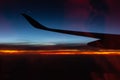 Jet in the sky at awesome sunrise. Plane wing above clouds. Beautiful view from airplane window. Morning colorful sky from plane. Royalty Free Stock Photo