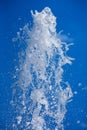 A jet of water sprayed under pressure from a fountain. Royalty Free Stock Photo