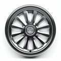 Jet Wheel Design: Black Metal Car Wheel With Playful Streamlined Forms Royalty Free Stock Photo