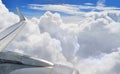 Jet wing and clouds. Royalty Free Stock Photo