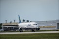 Jetblue airplane with hanger in background