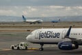 Jetblue airplane, a United Airlines jet, and a Breeze Airways plane passing at the Airport. Royalty Free Stock Photo