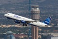 JetBlue Airways Airbus A320 aircraft taking off from McCarran International Airport Las Vegas with the air traffic control tower i