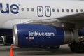 JetBlue plane on tarmac at Maurice Bishop International Airport in Grenada Royalty Free Stock Photo