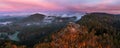 Jetrichovice, Czech Republic - Aerial panoramic view of Mariina Vyhlidka lookout with foggy autumn landscape