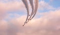 Jets fly in formation with colored smoke over Vancouver Harbor Royalty Free Stock Photo