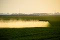 Jets of liquid fertilizer from the tractor sprayer Royalty Free Stock Photo