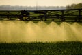 Jets of liquid fertilizer from the tractor sprayer Royalty Free Stock Photo