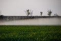 Jets of liquid fertilizer from the tractor sprayer Royalty Free Stock Photo