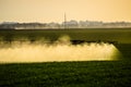 Jets of liquid fertilizer from the tractor sprayer Royalty Free Stock Photo