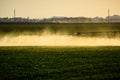 Jets of liquid fertilizer from the tractor sprayer Royalty Free Stock Photo