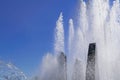 Splashes of fountain water in a sunny day