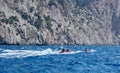 Jetskiers speeding in seaspray Royalty Free Stock Photo