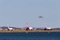 Jetstar Airbus A320 on approach to land at Sydney Airport with a Virgin Boeing 737, Qantas Airbus A330 and British Airways Boeing