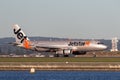 Jetstar Airways Airbus A320 airliner landing at Sydney Airport. Royalty Free Stock Photo