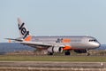 Jetstar Airways Airbus A320 airliner landing at Sydney Airport.