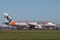 Jetstar Airways Airbus A320 airliner landing at Sydney Airport. Royalty Free Stock Photo