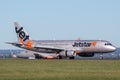 Jetstar Airways Airbus A320 airliner landing at Sydney Airport. Royalty Free Stock Photo