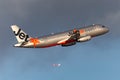 Jetstar Airways Airbus A320 twin engine passenger aircraft climbing on departure from Sydney Airport