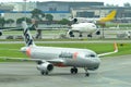 Jetstar Asia Airbus 320 low cost carrier taxiing to gate at Changi Airport