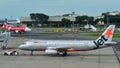 Jetstar Asia Airbus A320 pushing back at Changi Airport