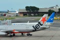Jetstar Asia A320 and Xiamen Air Boeing 737 parked at Changi Airport