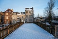 Jette, Brussels, Belgium - Pedestrian bridge covered with snow and residential houses