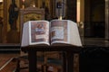 Jette, Brussels Capital Region - Belgium -Detail of an old bible at the altar of the Our Lady of Lourdes catholic church Royalty Free Stock Photo