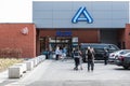 Jette, Brussels Capital Region - Belgium - People queuing at the local Aldi supermarket wearing mout masks