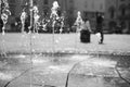 The jetting of the fountain in the city square. Royalty Free Stock Photo