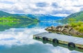 Jetty at amazing norwegian landscape mountains fjord forests Jotunheimen Norway