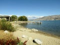 Jetty and boat dock at Peach Orchard Beach. Okanagan Lake, Summerland, BC, Canada. Royalty Free Stock Photo