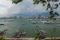 Jetty at Pattaya bay with blue sky and gray clouds covered Royalty Free Stock Photo