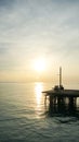 Jetty pier deck. sunset lake. purple and orange sky. A wooden pier at sunset. The pier is made of wooden planks and has a railing