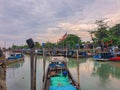 Jetty scenery with fishing boats anchored in Parit Jawa, Muar, Johor, Malaysia