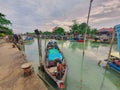 Jetty scenery with fishing boats anchored in Parit Jawa, Muar, Johor, Malaysia