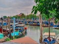 Jetty scenery with fishing boats anchored in Parit Jawa, Muar, Johor, Malaysia Royalty Free Stock Photo